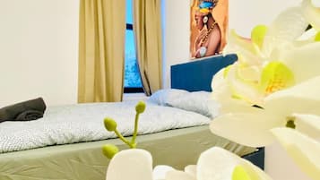 1 bedroom, desk, bed sheets