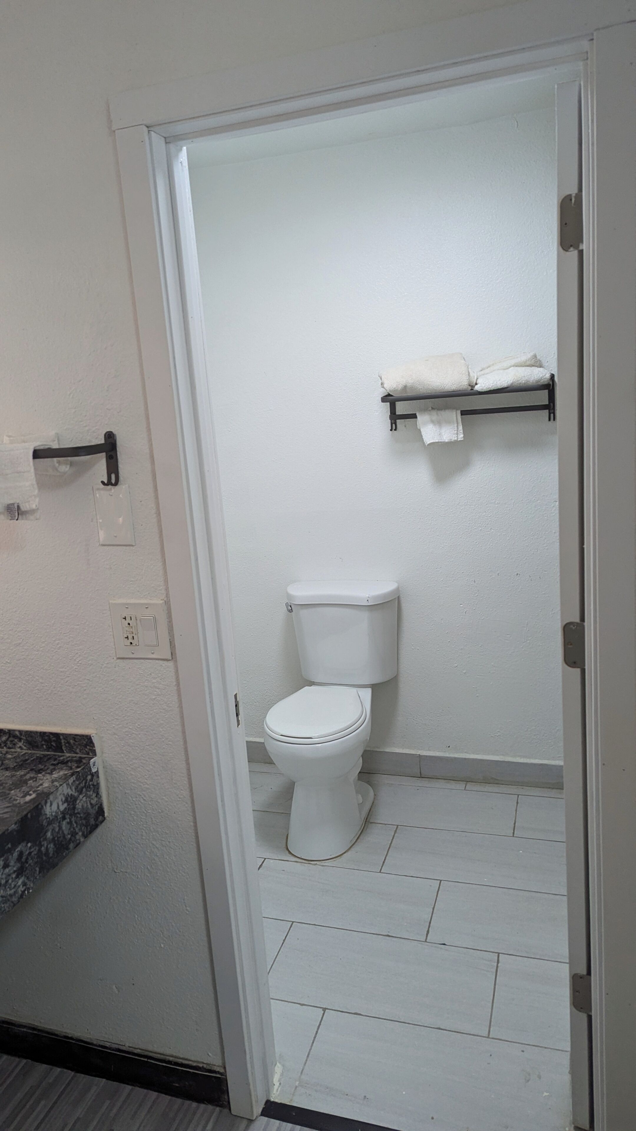 Bathtub, towels, soap, shampoo