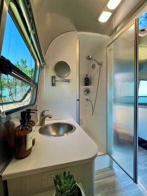 Shower, hair dryer, towels, soap