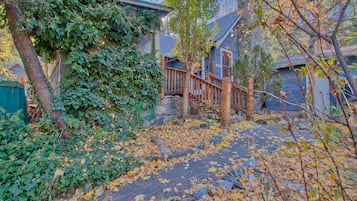 Stroll up the stone staircase to a serene retreat surrounded by lush greenery and trees.