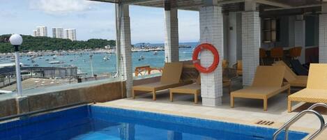 Outdoor pool, pool umbrellas, sun loungers