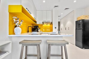 Fridge, microwave, oven, stovetop - Sleek Brand New Studio in Loci Residence JVC (Dubai)