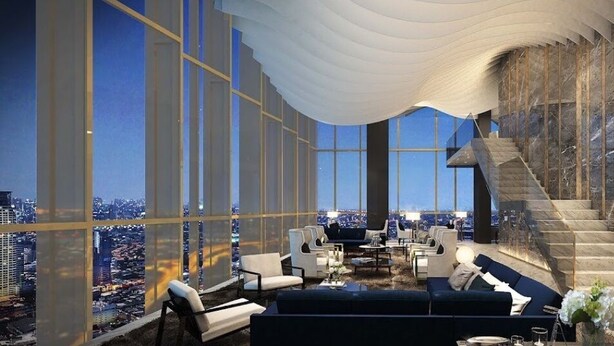 A luxurious interior with a high-rise city view, a staircase, and modern furnishings.
