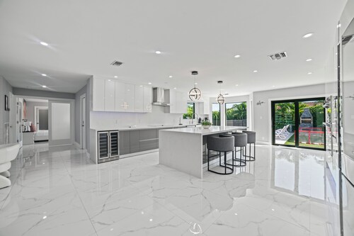 You'll be captivated by the stunning 28 x 40 custom heated pool with jacuzzi