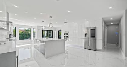 You'll be captivated by the stunning 28 x 40 custom heated pool with jacuzzi