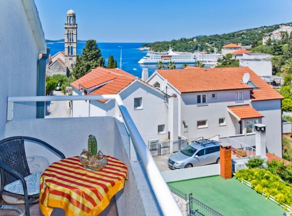 Enjoy the breathtaking view of the coastal town from your balcony.