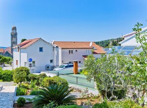 Stunning residential area with a historic bell tower and well-manicured gardens.