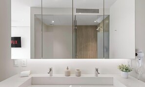 Shower, hair dryer, towels, shampoo