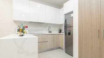 Fridge, microwave, stovetop, coffee/tea maker