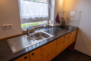 Fridge, stovetop, coffee/tea maker, electric kettle