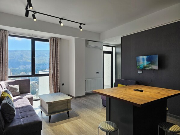 Family Apartment, City View | Living area | Flat-screen TV - Two bedroom with balcony and terrace (Tbilisi)