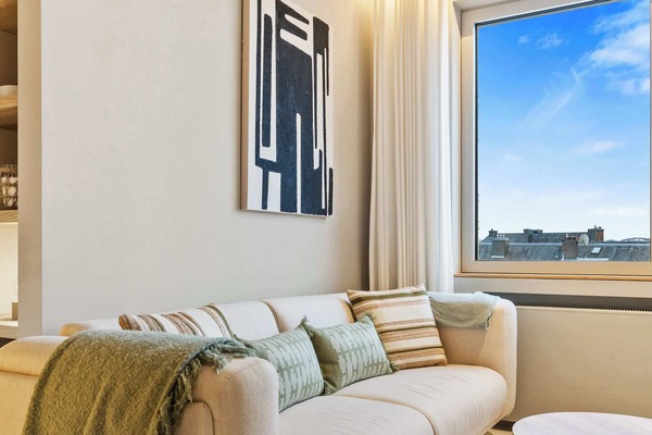 Cozy Comfort Awaits – Sink into this plush sofa, perfect for relaxing after a day of exploring.