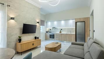 Luxury Apartment, City View | Living area | 43-inch Smart TV with cable channels
