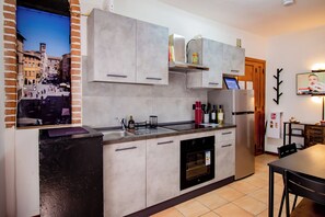 Fridge, oven, coffee/tea maker, cookware/dishes/utensils