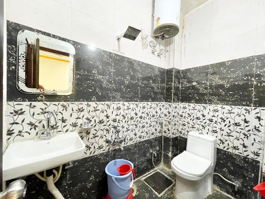 A bathroom with a sink, toilet, and shower.