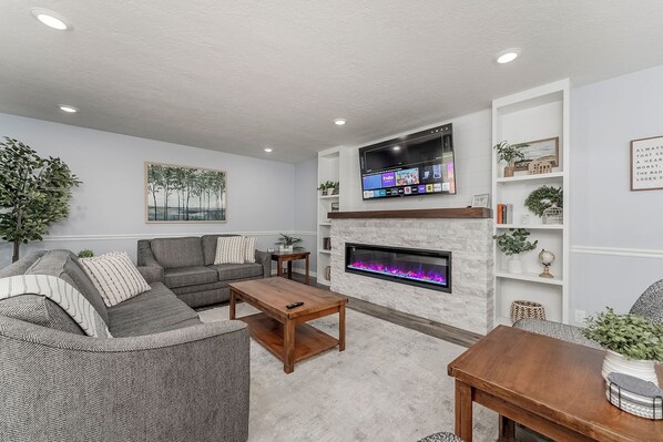 TV, fireplace, books, offices