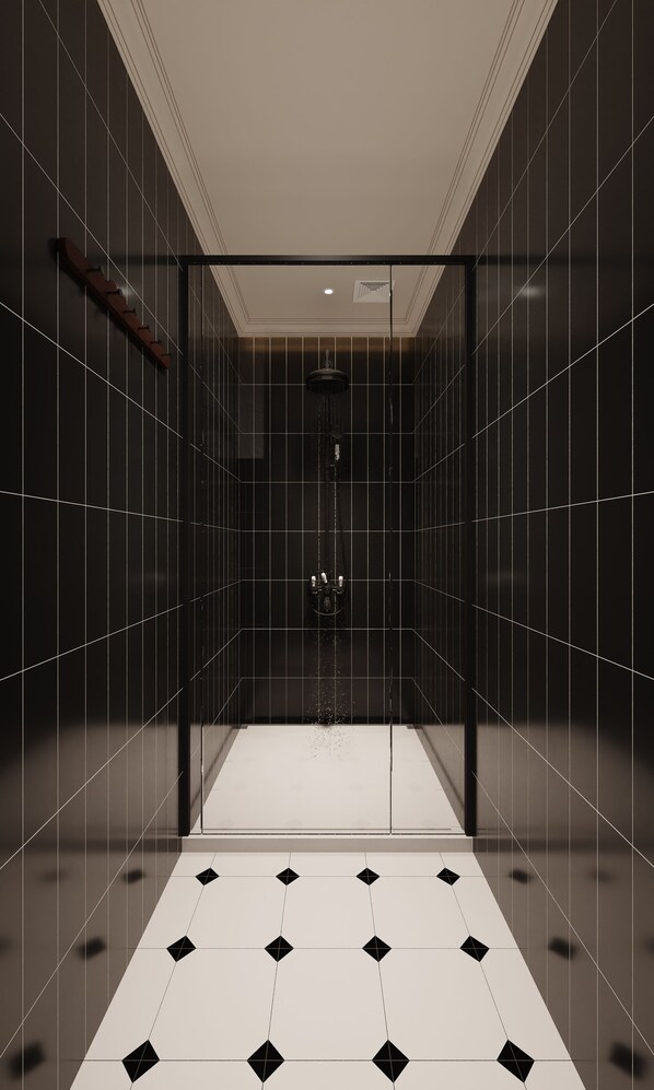 A modern, dark-themed bathroom with a glass-enclosed shower, a visible showerhead, and a tiled floor with a geometric pattern. - Jianzhi Erqi Youth Hostel Xihu Branch (Hangzhou)