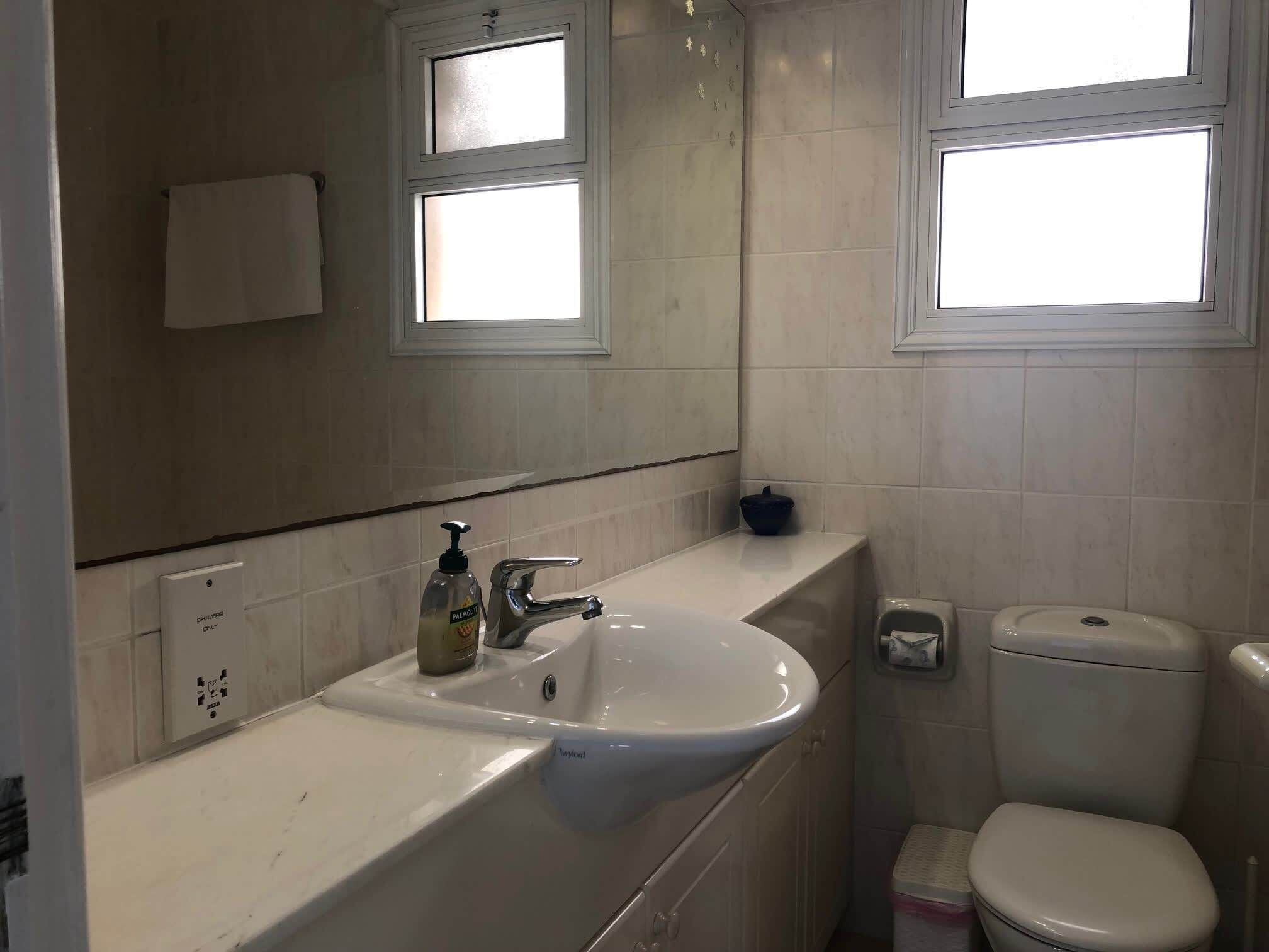 Shared bathroom with large vanity
