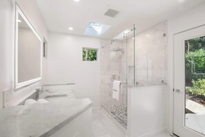 Shower, hair dryer, towels, shampoo