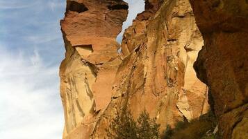 A natural rock formation with a clear sky.
