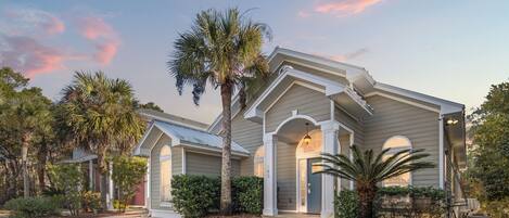 A two-story house with a front porch, a covered entryway, and a garage.