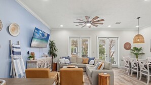 House, Multiple Beds, Balcony, Garden View (7818 Thomas Dr) | Living area - Escape to Sand Dollar Holler: Coastal Retreat, 3 Beds, 2.5 Baths, Sleeps 10! (Panama City Beach)