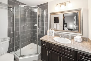 Shower, hair dryer, towels, soap