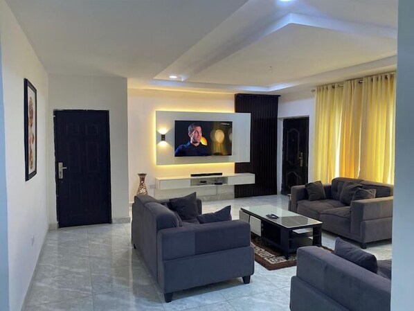 Deluxe Apartment, Balcony, City View | Living area - Plot 35 Apartments (Owerri)