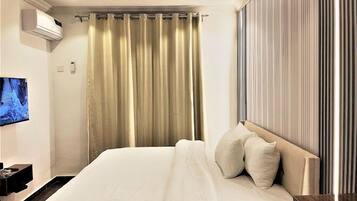 Departamento Deluxe, balcón, vista a la ciudad | 2 habitaciones, escritorio y espacio para trabajar con laptop