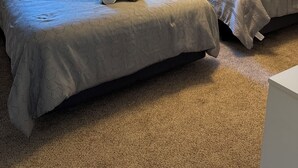 A bedroom with two beds, a ceiling fan, and a window with blinds. - The Amazing 4 Bed 2 Bath of Independence (Independence)