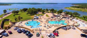 Large porch offers beautiful views of the lake. Enjoy unique interior design!