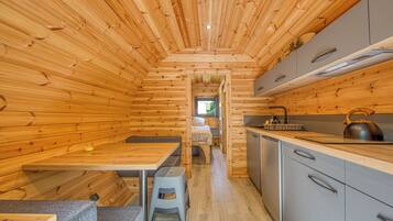 Fridge, microwave, coffee/tea maker, cookware/dishes/utensils