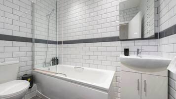 Shower, hair dryer, towels, shampoo