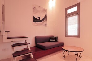 Deluxe Duplex | Living area | TV
