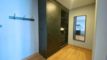 Family Triple Room, City View | 1 bedroom, in-room safe, desk, laptop workspace