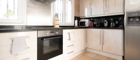 Villa | Private kitchen | Fridge, microwave, oven, dishwasher