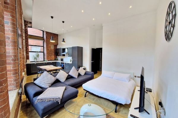 Deluxe Apartment | Living area | 40-inch LCD TV with cable channels