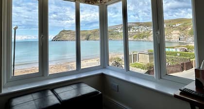 Beautiful cottage opposite Port Erin bay. Garden above beach. Fabulous sunsets!