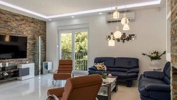Villa (Four Bedroom Villa with Pool) | Living room | 32-inch flat-screen TV with digital channels