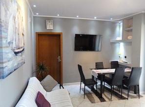 Apartment (Two Bedroom Apartment with Balcony) | Living room | 32-inch flat-screen TV with satellite channels - Scenic and Sunny Apartments With Sea View and Balcony (Crikvenica)