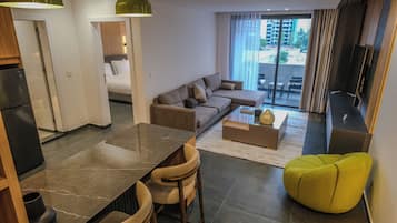 Deluxe Apartment, Balcony, City View | In-room safe, blackout curtains, soundproofing, iron/ironing board