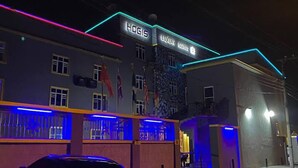 A building with a sign reading "HOGIS LUXURY SUITES". - Hogis Luxury Suites and Hotel (Calabar)