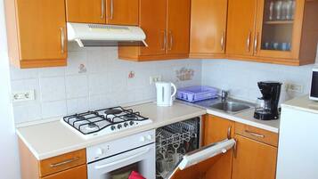 Apartment (Two Bedroom Apartment with Sea View a) | Private kitchen | Fridge