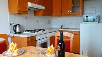 Apartment (Two Bedroom Apartment with Sea View a) | Private kitchen | Fridge