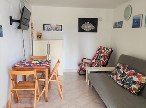 Apartment (One Bedroom Apartment with Terrace an) | Living room | 25-inch flat-screen TV with satellite channels