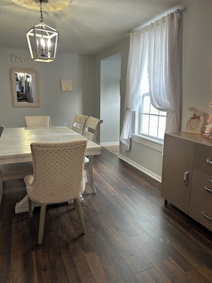 Enjoy meals in this cozy dining area with a central table and four chairs.