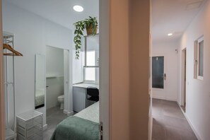 Shower, hair dryer, towels, toilet paper