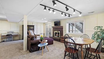 Smart TV, fireplace, books, computer monitors