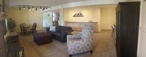 Smart TV, fireplace, books, computer monitors