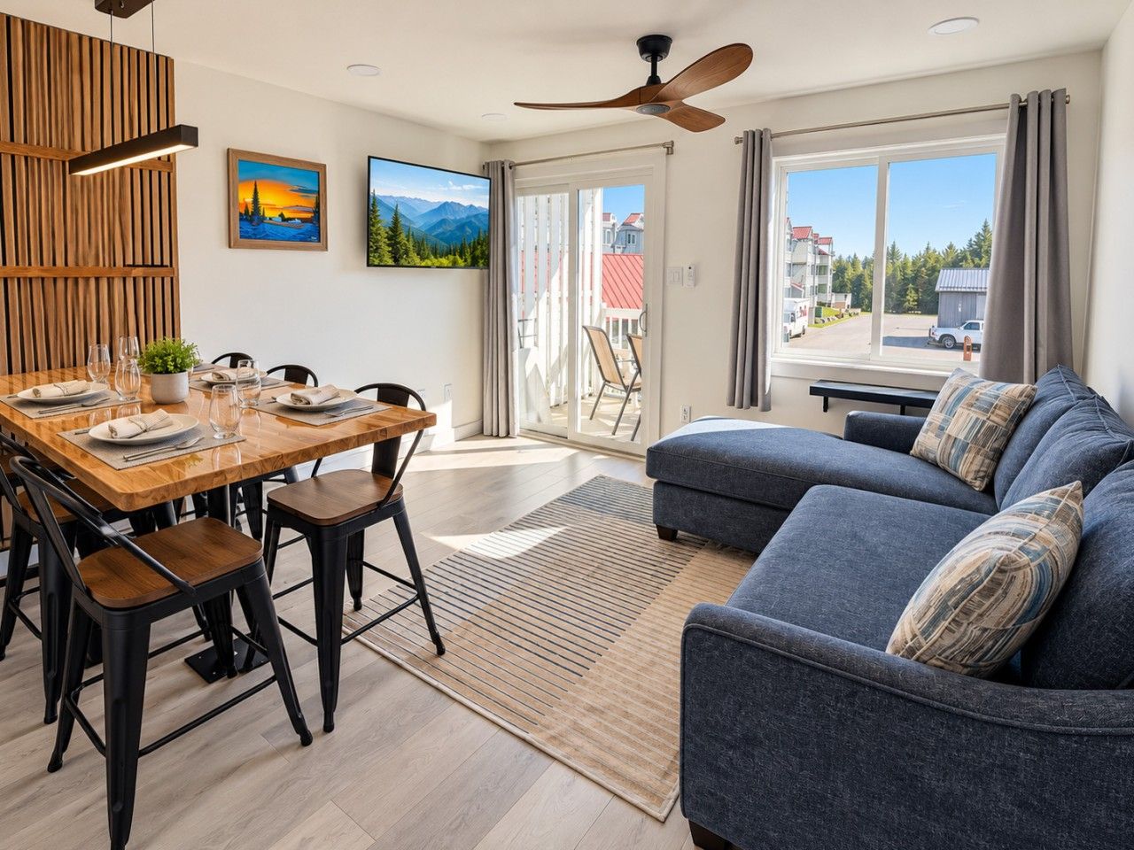 Bright, renovated living and dining space with comfortable seating and access to the private balcony.